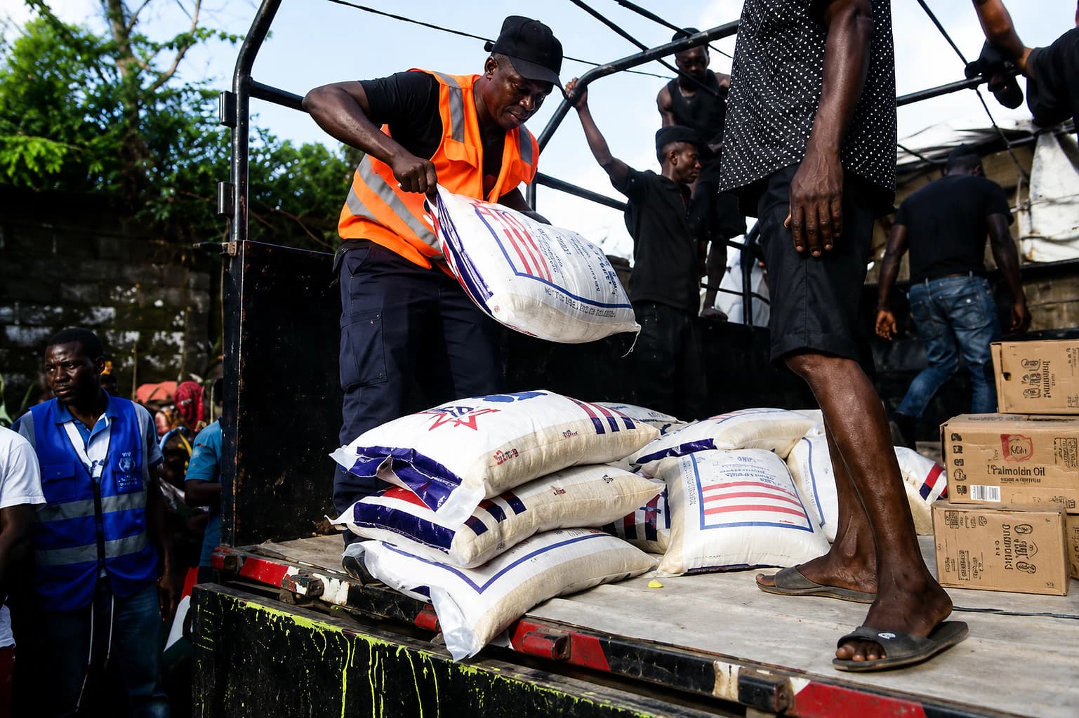 Men offloading rice in monrovia